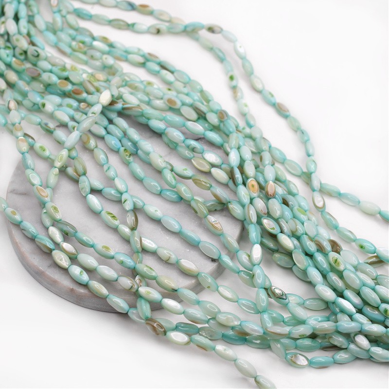 Shell beads/ mint olives approx. 5x11mm/ cord 38cm MU139L