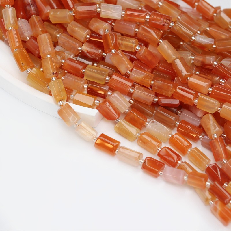 Botswana Orange agate/ faceted rollers approx. 7x10mm/ 15 pcs (rope) KAAGBOWA01