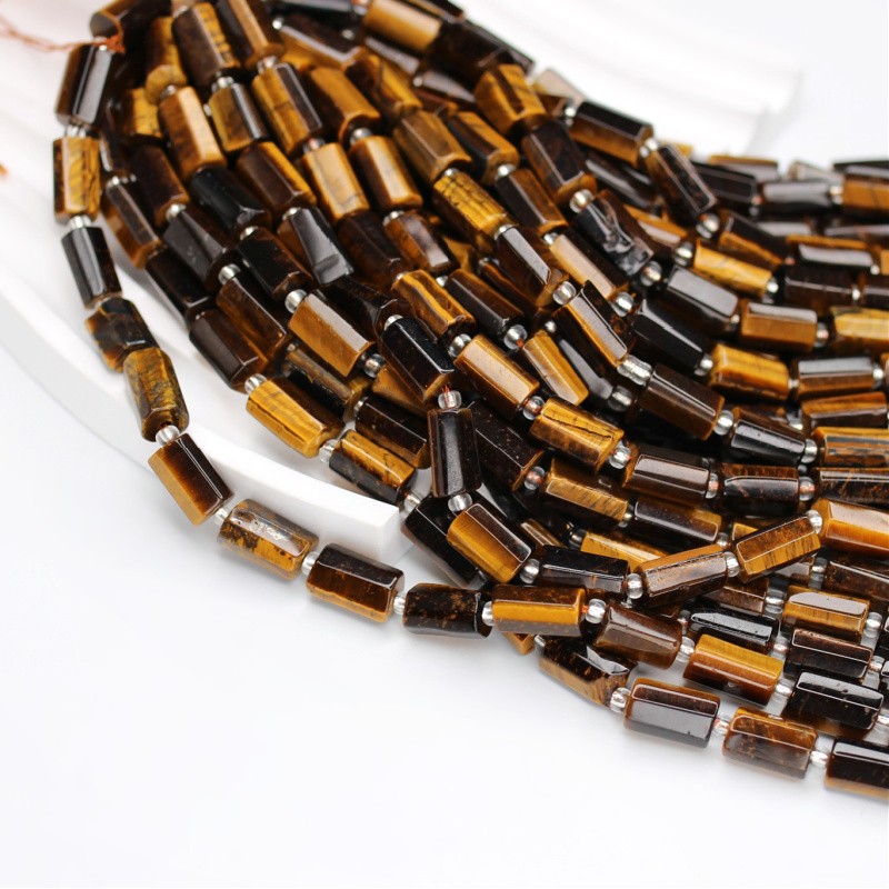 Tiger eye/ faceted irregular rollers approx. 7x11mm/ 15 pcs/ cord KATEWA01