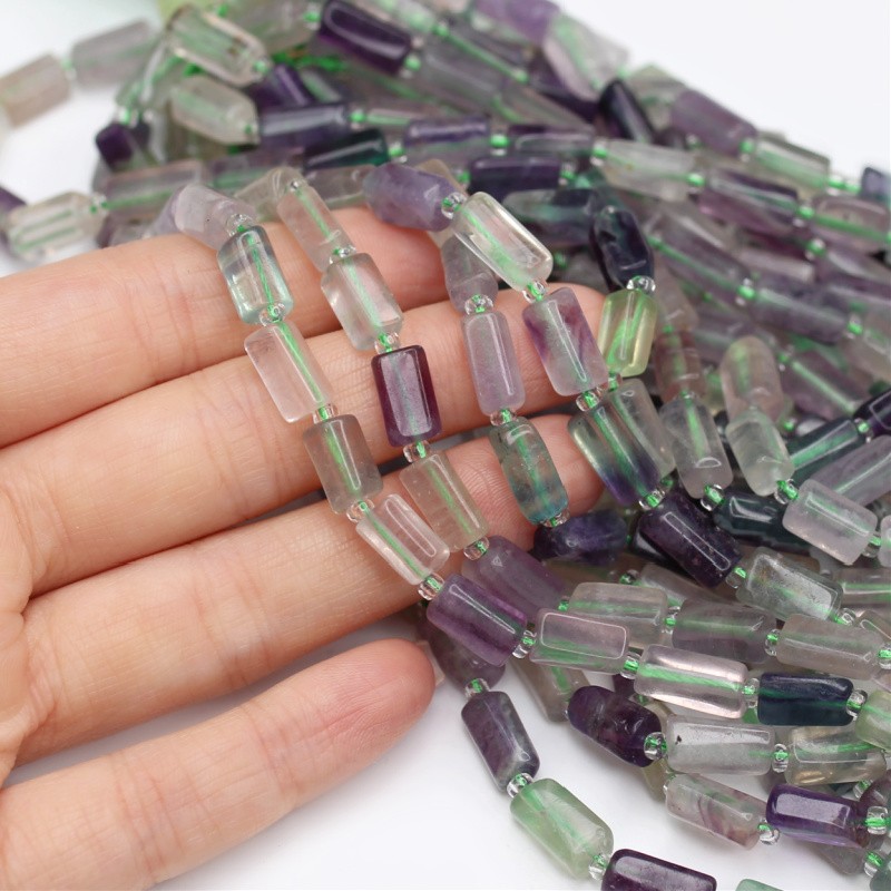 Irregular fluorite/ faceted rollers approx. 6x11mm 15 pcs/ cord KAFLWA01