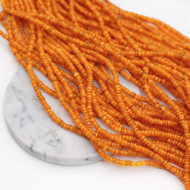 Koraliki z masy perłowej/ pomarańczowy/ nieregularne krążki ok. 4mm/ 38cm MU232C
