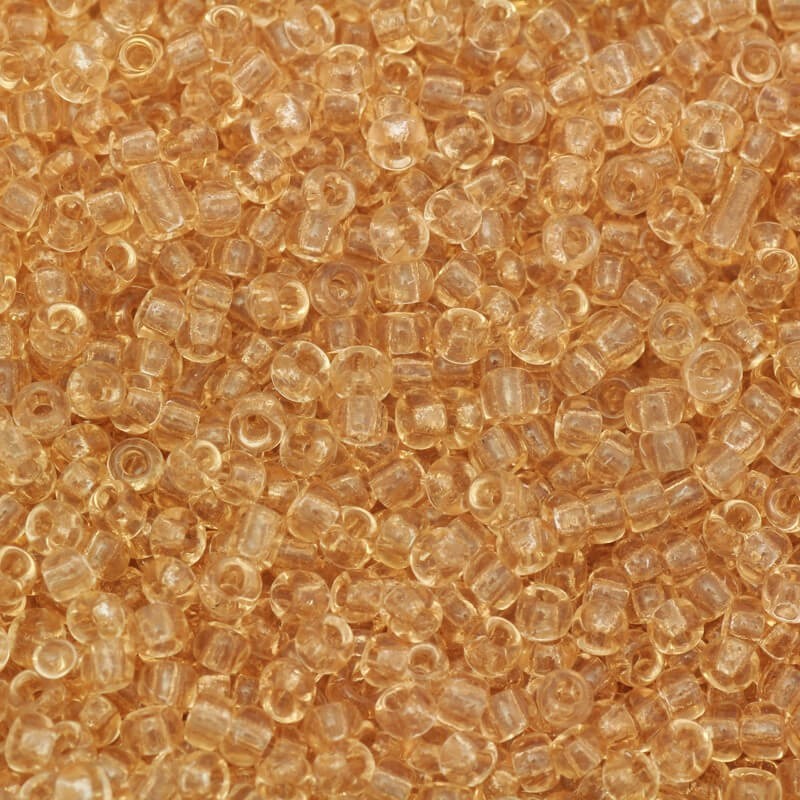 Koraliki drobne transparentne brzoskwiniowe (11/0) 2x2mm 25g SZMN22TR014
