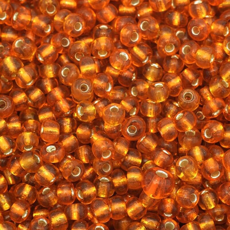 Koraliki drobne transparentne na srebrnej folii pomarańczowe (9/0) 2x3mm 25g SZMN23SF008