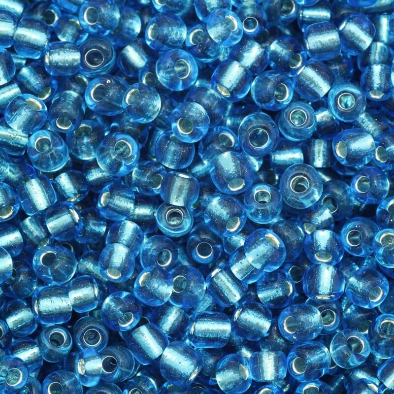 Koraliki drobne transparentne na srebrnej folii błękitne (9/0) 2x3mm 25g SZMN23SF010