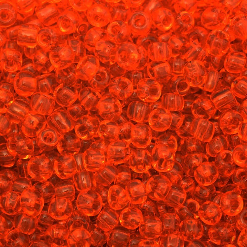 Koraliki drobne transparentne pomarańczowe (9/0) 2x3mm 25g SZMN23TR005
