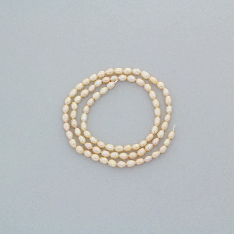 Freshwater pearls / salmon / rope 38cm / oval ribbed / 2.5-3mm PASW134
