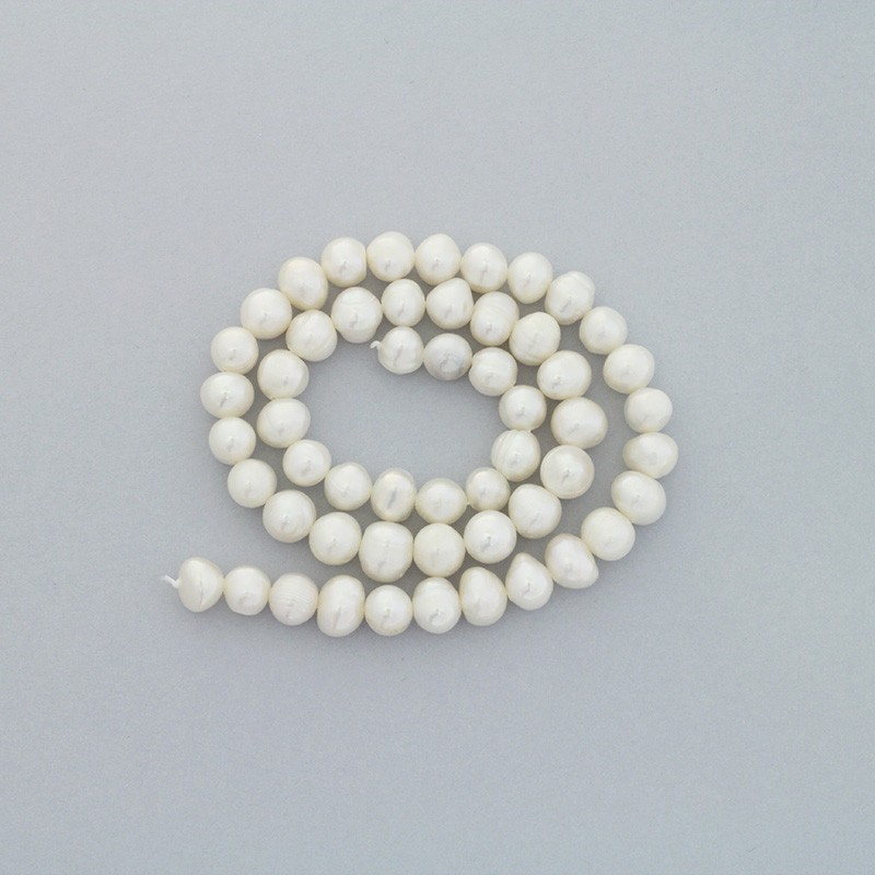 Freshwater pearls / white rope 63pcs / oval / 7-8mm PASW147
