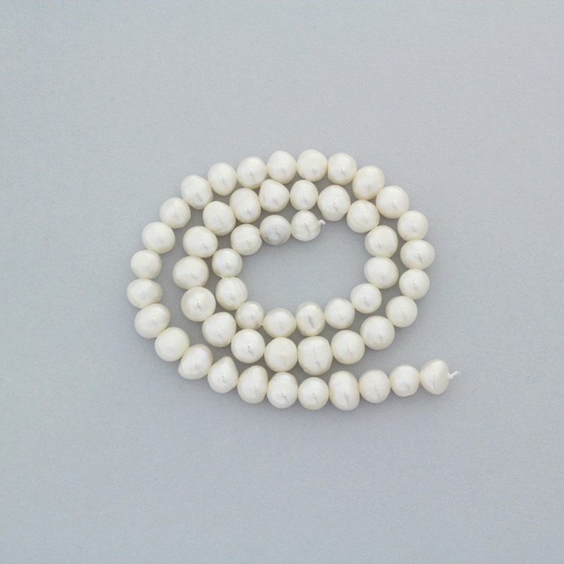 Freshwater pearls / white rope 63pcs / oval / 7-8mm PASW147