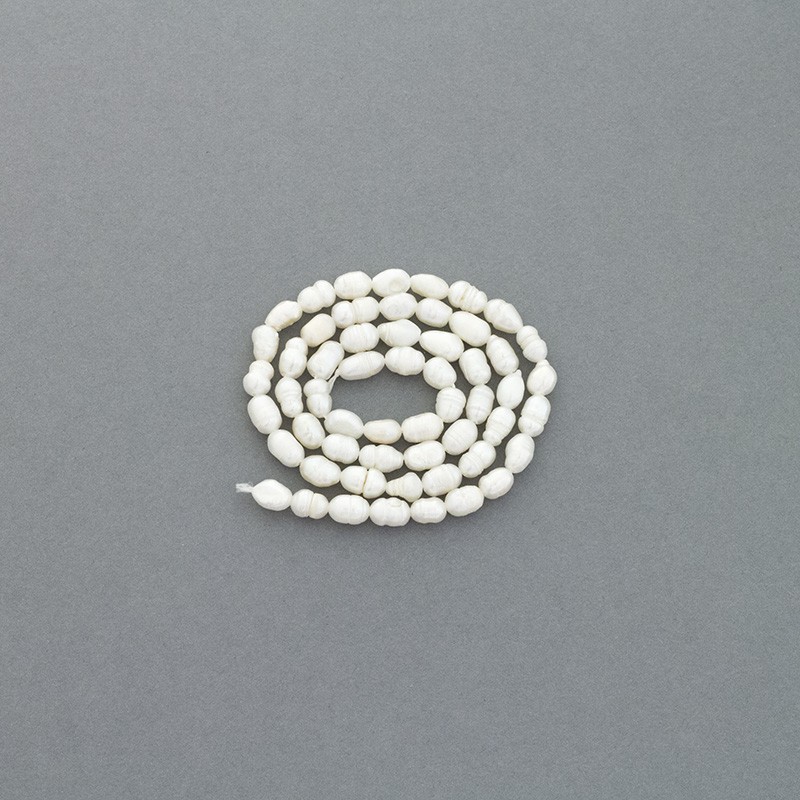 Freshwater pearls / white string 38cm / oval ribbed / 4.2mm PASW145N