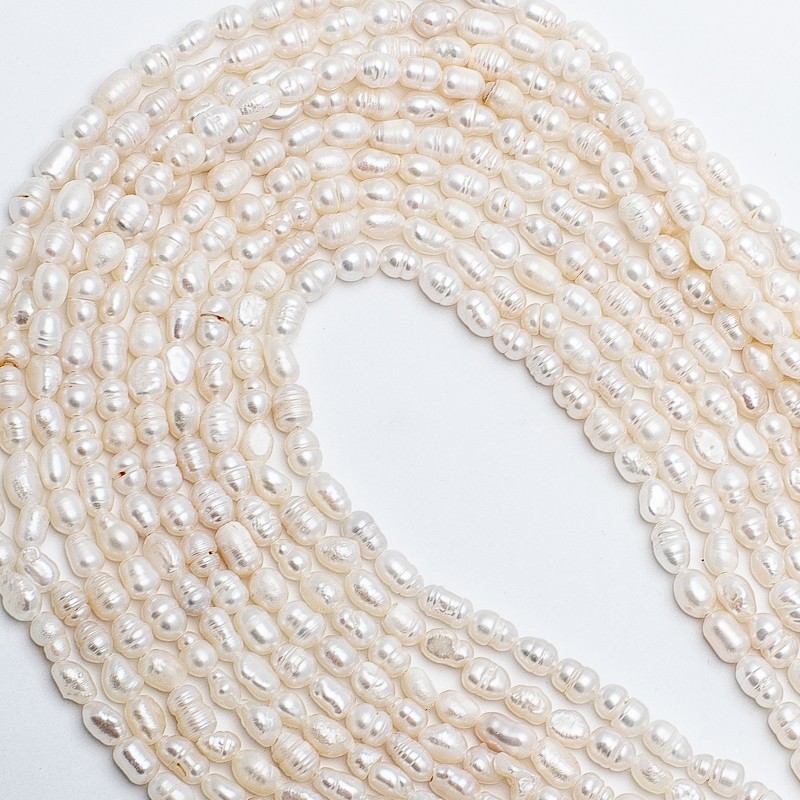 Freshwater pearls / string 36cm / oval ribbed / 4-5mm PASW196