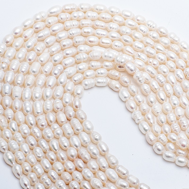 Freshwater pearls / string 34cm / oval ribbed / 6-7mm PASW199