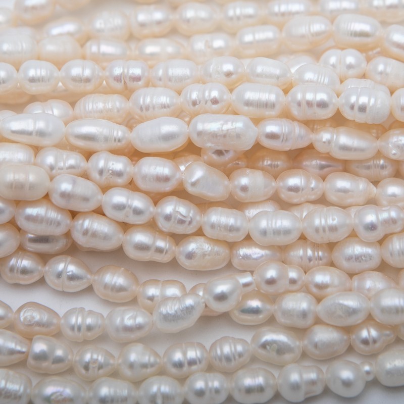 Freshwater pearls / string 34cm / oval ribbed / 6-7mm PASW199
